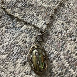 Vintage Fossil beetle locket necklace